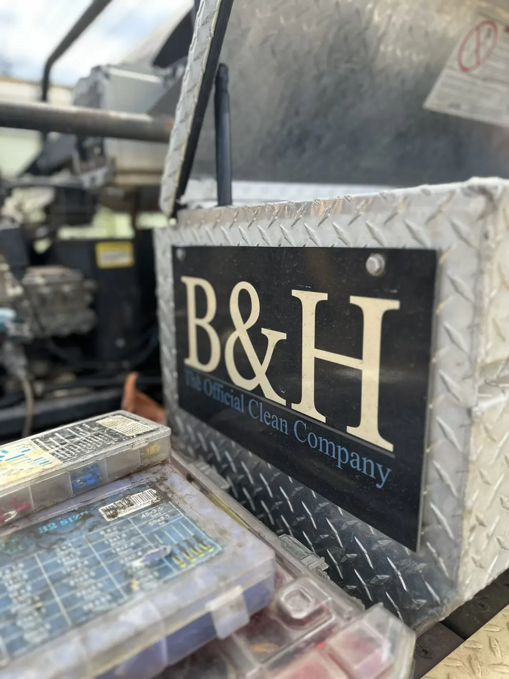 B&H The Official Clean Company plate on a rig toolbox